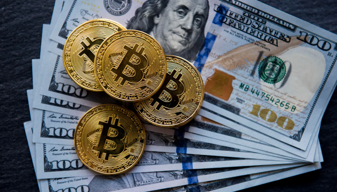 The image features a stack of dollar bills, including both US dollars and Bitcoin coins, laid out on a black surface with a white border. There are five gold Bitcoins scattered among the bills, one of which has a text overlay that reads "Bitcoin". In the backdrop of this unusual scene, there is a post by The Fool about US spot ETFs hitting their longest outflow streak in 13 straight days, with a total withdrawal of $4B and an additional $BTC being taken away. It suggests that people have been selling Bitcoin to fund these ETFs during this period.