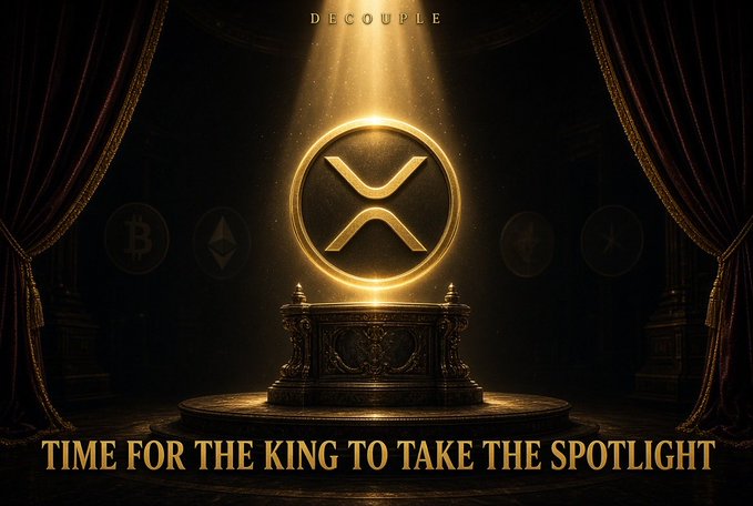 A promotional graphic featuring a golden XRP (Ripple) cryptocurrency coin displayed on an ornate pedestal under a spotlight, with the text 'DECOUPLE' at the top and 'TIME FOR THE KING TO TAKE THE SPOTLIGHT' at the bottom.