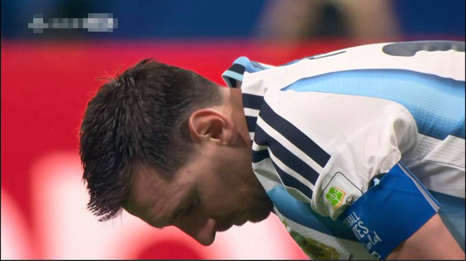 Lionel Messi, wearing Argentina's blue and white striped jersey with the captain's armband, looks down dejectedly, mirroring the user's heartbreak after their betting prediction went wrong during the Argentina vs. Egypt World Cup match.