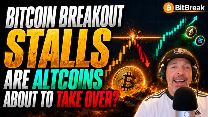 The image is a BitBreak YouTube thumbnail featuring a smiling host wearing headphones next to bold text reading "BITCOIN BREAKOUT STALLS - ARE ALTCOINS ABOUT TO TAKE OVER?" alongside Bitcoin and cryptocurrency graphics. The caption complements the post by highlighting Bitcoin's stalled breakout at the Yearly Open resistance level, setting up speculation about whether altcoins will lead the next market move.