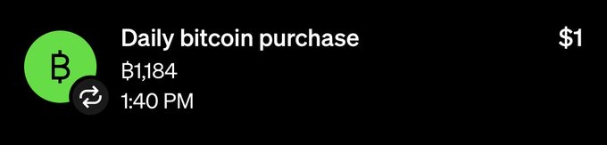 A cryptocurrency transaction notification displaying a green Bitcoin logo with the text 'Daily bitcoin purchase', amount '฿1,184', and value '$1' at 1:40 PM.