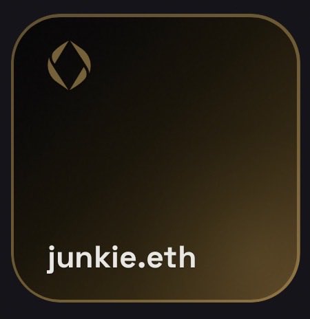 A dark brown/black gradient app icon with a small flame logo and the text 'junkie.eth' at the bottom.