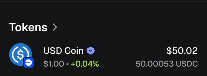 A wallet screen showing a Tokens balance of 50.00053 USDC (USD Coin) valued at $50.02 with a +0.04% gain.