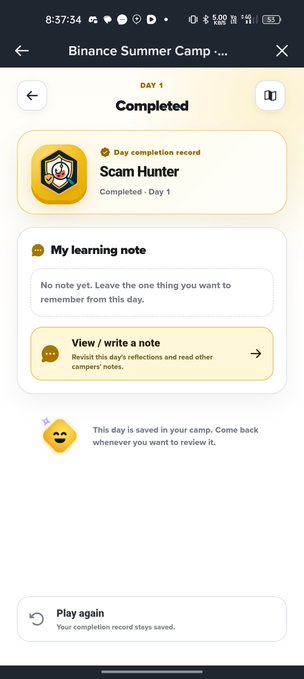A mobile app screenshot titled 'Binance Summer Camp' showing a completed Day 1 lesson titled 'Scam Hunter' with options to write a learning note or play again.
