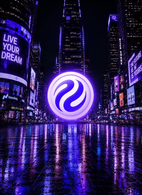 The image features a city street at night with buildings lit up, creating a vibrant atmosphere. The most prominent feature of this scene is a large purple circle that stands out against the dark background. This circular object appears to be glowing or emitting light from within, drawing attention and curiosity. The surrounding area includes billboards and advertisements, which are also illuminated in various colors, contributing to the overall brightness of the cityscape. The image seems to be related to an advertisement for Injective, a company that focuses on building infrastructure specifically for finance.
