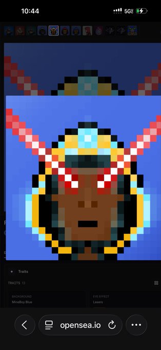 A pixel art portrait of a character with red eyes, a glowing blue forehead gem, and wing-like protrusions, displayed on the OpenSea.io mobile site under the trait "Mindflay Blue."