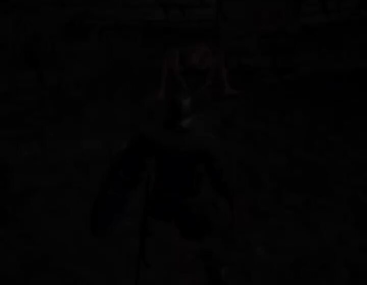 The image shows a person wearing black clothing, possibly a shirt or jacket, standing against a dark background with their back facing the camera. The photo has been edited to appear as if they are in a dimly lit room, giving an eerie atmosphere to the scene. The caption of the image reads "Just found my bro that got into $BTC at $125k", which seems to be a reference to a recent event involving money and a person named "bro".