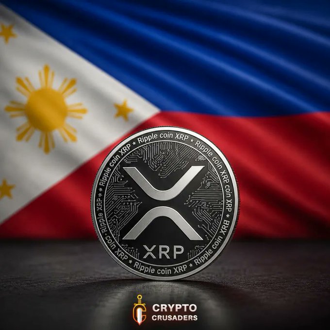 A silver Ripple (XRP) coin displayed against the Philippine flag, branded with 'CRYPTO CRUSADERS' watermark at the bottom.