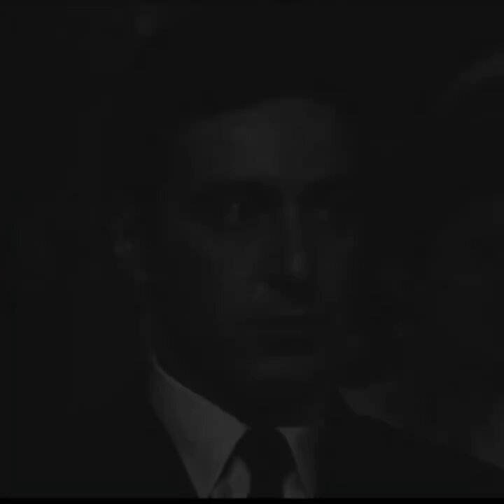 The image features a man wearing a suit, tie, and white shirt with his face obscured by darkness. The background appears to be black, which contrasts with the man's attire. There are no other objects or people visible in the image. The caption "It takes one big win to erase all those loses. Just one big win." is written above the man's head, but it does not provide any additional context about the image or its content.