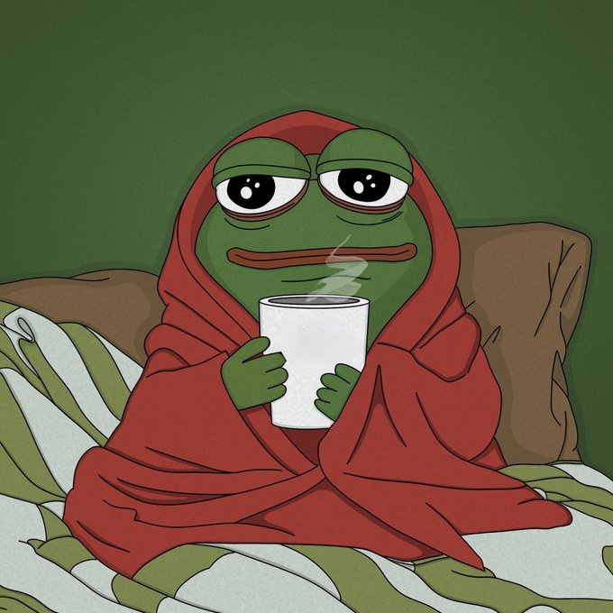 The image features a cartoon frog wrapped up in a blanket, holding a cup of coffee while sitting on a bed. The frog appears to be enjoying its warm beverage as it sits comfortably on the bed.