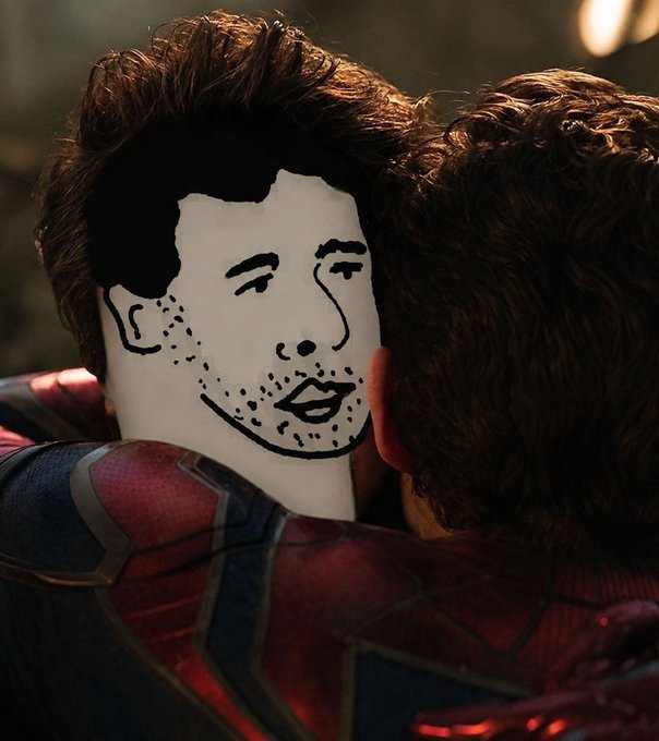 A close-up of two characters embracing, one with a crudely drawn face doodled on a white patch covering their features, evoking a meme-like edit.