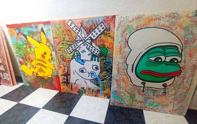 The image features a row of three paintings, each with different themes and styles. The first painting depicts a yellow Pokemon character, the second one shows a green frog wearing a helmet, and the third one portrays an angry face. These artworks are displayed on a checkered floor in front of a white wall, creating an interesting contrast between the colorful paintings and their surroundings. The post "UNO CANVASES" suggests that these paintings might be part of an online art gallery or a collection showcasing various styles and themes.