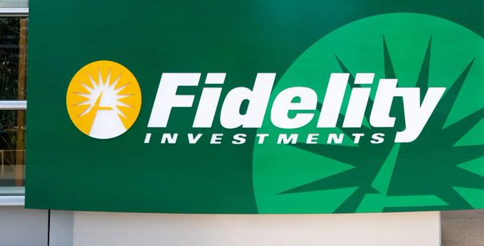 A green Fidelity Investments sign is displayed on the side of a building, featuring the company's yellow sunburst logo alongside bold white text. The image visually anchors the accompanying news about Fidelity's $7 trillion asset management arm expanding its Ethereum ETF into a yield-generating product through staking rewards distributed quarterly to investors.