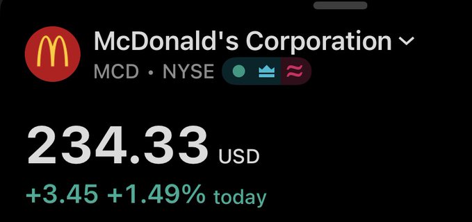 A stock ticker displays McDonald's Corporation (MCD) on the NYSE at $234.33 USD, showing a gain of $3.45 or +1.49% for the day against a dark background.