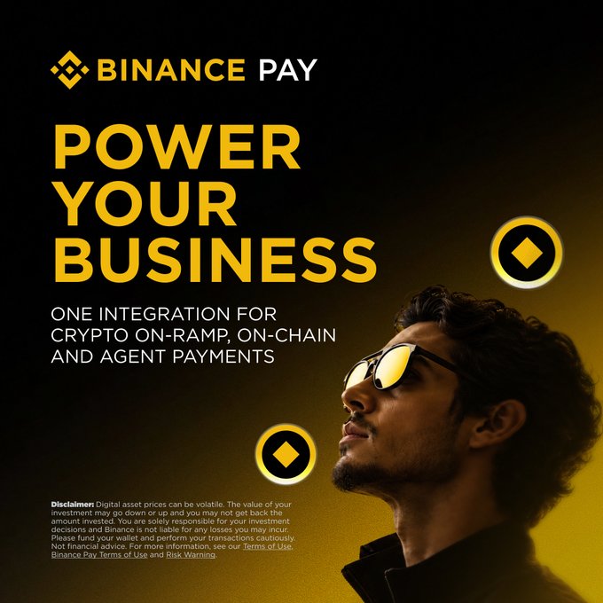A Binance Pay promotional graphic features a man in reflective sunglasses gazing upward against a dark background with yellow accents, alongside Binance's diamond logo and floating coin icons. The bold text reads "POWER YOUR BUSINESS" with the tagline "ONE INTEGRATION FOR CRYPTO ON-RAMP, ON-CHAIN AND AGENT PAYMENTS," reinforcing the post's message about Binance Pay's on-chain payment infrastructure for businesses to build upon.