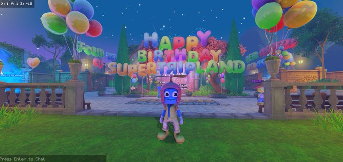 A screenshot from a video game showing an animated character standing in front of a 'HAPPY BIRTHDAY SUPERTRIPLAND' sign decorated with colorful balloons and garden scenery.