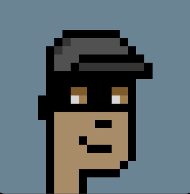 A pixel-art portrait of a Cryptopunk character wearing a gray fedora, featuring brown eyes and a neutral expression against a blue background. The stylized avatar serves as a personalized digital collectible among the 10,000 unique Cryptopunks series.