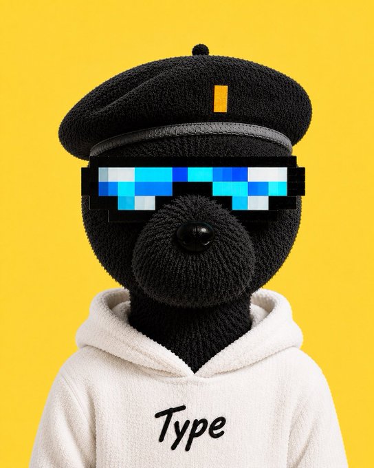 A black knit teddy bear wearing pixelated blue "deal with it" sunglasses and a cap poses against a yellow background, sporting a white hoodie with "Type" printed on it—fitting the bullish "Type Thursday" market celebration vibe of the post.