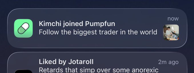 A screenshot of a Pumpfun notification reads, “Kimchi joined Pumpfun” and “Follow the biggest trader in the world,” with a profile image and “now” timestamp; below it is a post saying “Liked by Jotaroll” and “Rewards that simp over some anorexic.” The notification supports the accompanying claim that Pumpfun is promoting or “Psyop”ing users into viewing Kimchi as a celebrity trader.