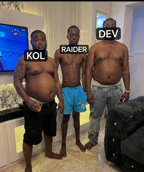 A humorous photo showing three shirtless men labeled 'KOL', 'RAIDER', and 'DEV' (representing crypto/web3 roles: Key Opinion Leader, Raider, and Developer), standing side-by-side in a living room.