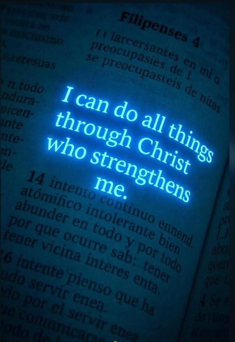 A Bible page from Philippians 4 with the highlighted verse 'I can do all things through Christ who strengthens me' glowing in blue.