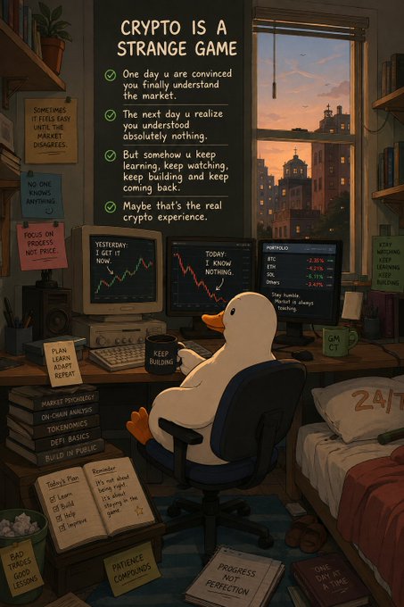 An illustration titled "CRYPTO IS A STRANGE GAME" featuring a duck sitting at a desk with multiple monitors showing market data, surrounded by sticky notes about trading and building habits.