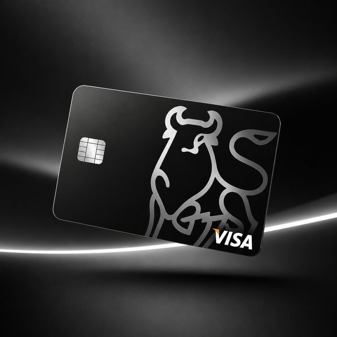 A sleek black credit card featuring a stylized bull logo and the VISA logo, displayed against a dark background with dramatic lighting.
