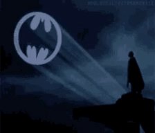 The image shows a batman-themed scene, with a large batman logo situated at the center of the frame. The background features a dark blue sky and a silhouette of Batman, indicating that the photo may be related to an online post or social media. The caption "Countertrade signal activated" seems to refer to the recent appearance in this image by Batman.