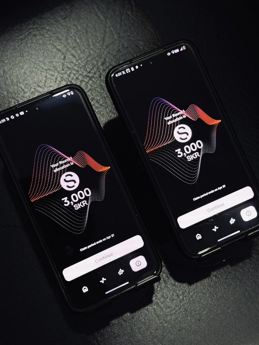Two smartphones displaying a Shaga app with a 3,000 SKR token reward screen on dark backgrounds.