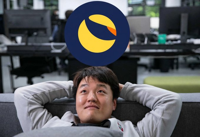 A man leans back on a couch looking upward with his hands behind his head, with a large LUNC (Luna Classic) cryptocurrency logo overlaid above him, visually linking Do Kwon's continued imprisonment and his lingering influence on LUNC's price volatility four years after the 2022 Terra collapse.