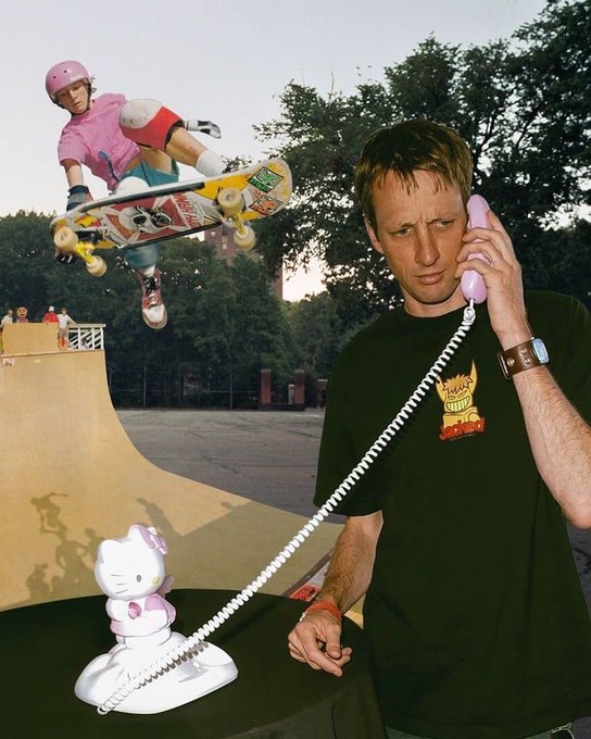 A man looks annoyed while holding the receiver of a Hello Kitty telephone, with a skateboarder performing a kickflip on a halfpipe in the background.