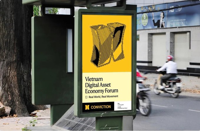 An outdoor billboard advertising the 'Vietnam Digital Asset Economy Forum' sponsored by Conviction, with a yellow and black design featuring a stylized 'V' logo, while motorbikes pass by on the street.
