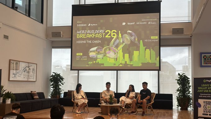 A panel discussion at the Web3 Builders Breakfast 26, sponsored by SQR DAO, takes place with four speakers seated on stage while the large screen displays "Hiding the Chain" and "Hồ Chí Minh" branding, connecting to the post about meeting SQR DAO and Empower folks with Conviction.