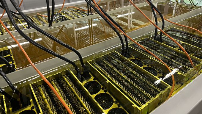 The image shows several rows of black and yellow computer servers, possibly used for data storage or processing tasks. There are at least 13 servers visible in the scene. The servers appear to be connected by orange cables, indicating that they might be part of a network or system. The text "Thailand authorities have seized" suggests that there has been an incident involving these servers and their connection to electricity. It is unclear what specific details about this incident are being discussed on the post, but it appears to involve illegal Bitcoin mining operations and potential power theft.