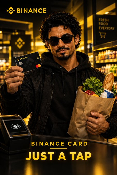 A Binance advertisement featuring a man holding a Binance card and a grocery bag at a checkout counter, with the text 'BINANCE CARD JUST A TAP'.