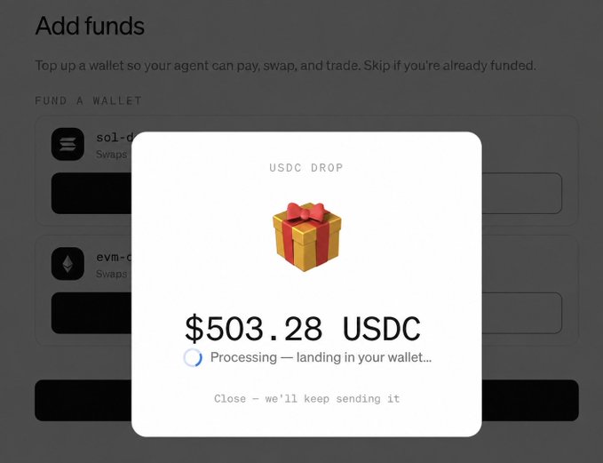 A pop-up window titled "USDC DROP" shows a gift box emoji and the amount "$503.28 USDC" with the status "Processing — landing in your wallet..." over an "Add funds" page for funding crypto wallets (sol-d, evm-c).