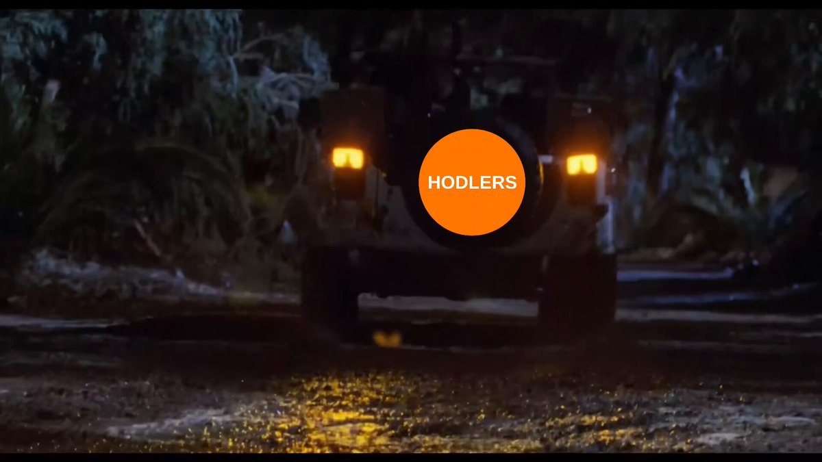 The image shows a car driving down a road at night, with its headlights on. In the background, there are trees that add to the nighttime atmosphere of the scene. The text "Holding Bitcoin in 2026 be like" suggests that the car is being used for an activity related to Bitcoin mining or cryptocurrency trading. This implies that the car's owner might be involved in the process of mining Bitcoins or has recently mined a batch of Bitcoins and is now transporting them using their vehicle.