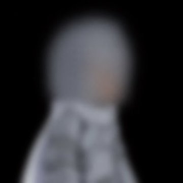 A heavily blurred portrait photograph of a person, making facial features indistinguishable.