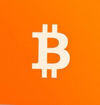 Orange square graphic displaying the white Bitcoin (BTC) logo.