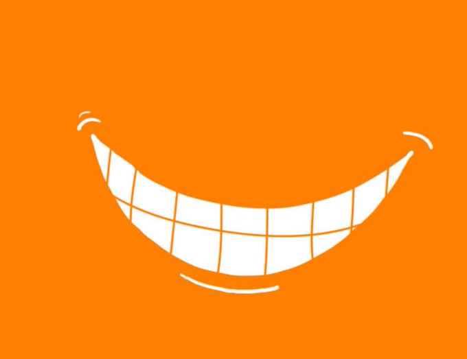 iced orange background with a white smiley face, featuring a large mouth and two rows of teeth.