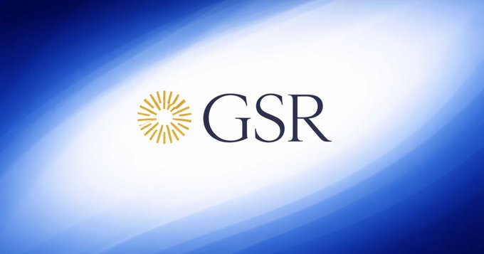The image displays the GSR logo, featuring a golden sunburst emblem beside the dark blue "GSR" lettering against a flowing blue gradient background. The logo represents GSR, the crypto market maker and trading firm mentioned in the post, which has notably reduced Bitcoin's allocation to 16.9% in favor of Solana and Ethereum in its Core3 model.