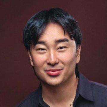 A young man with dark hair smiles at the camera against a maroon background, wearing a dark collared shirt and a thin gold chain. The image likely represents one of the two founders mentioned in the post—either seyong or a1lon9—who are praised as net positives to their space.