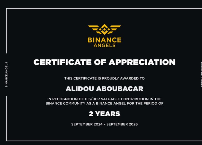 A black 'BINANCE ANGELS' certificate of appreciation awarded to 'ALIDOU ABOUBACAR' for 2 years of service (September 2024 – September 2026) as a Binance Angel in the community.