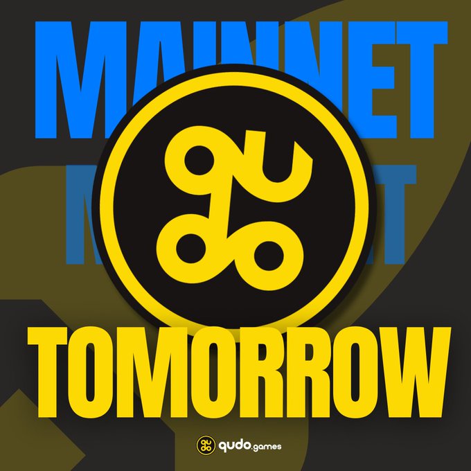 A graphic announcing 'MAINNET TOMORROW' in bold blue and yellow text, featuring a yellow logo and 'qudo.games' branding at the bottom.