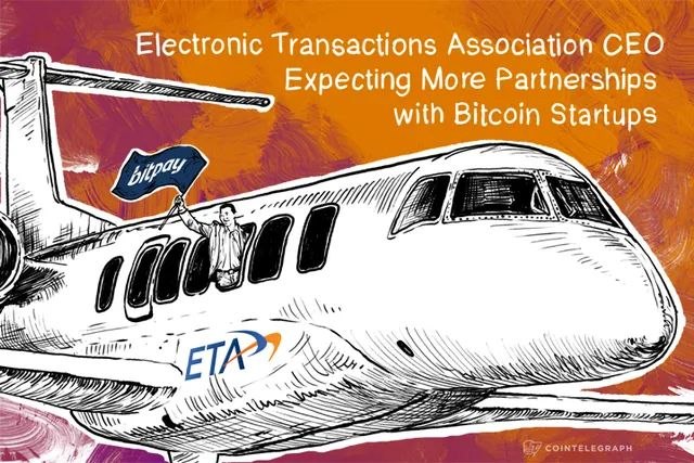 A stylized illustration shows a figure waving a "bitpay" flag while emerging from an airplane branded with the "ETA" (Electronic Transactions Association) logo, set against an orange brushstroke background. The headline reads "Electronic Transactions Association CEO Expecting More Partnerships with Bitcoin Startups," visually reinforcing the article's theme of growing collaboration between the traditional payments industry and cryptocurrency startups.
