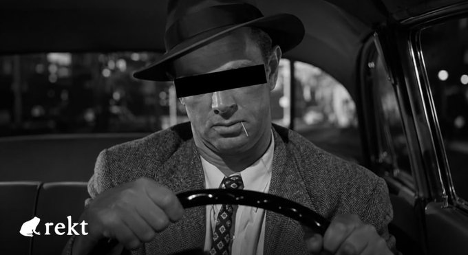 A black-and-white noir-style image shows a man in a fedora and tweed suit sitting in the backseat of a car, gripping the steering wheel with his eyes censored by a black bar and a toothpick in his mouth, with the "rekt" logo in the corner—evoking the secretive, sleuth-like tone of uncovering hidden exploits like the $50M Nesa bridge hack.