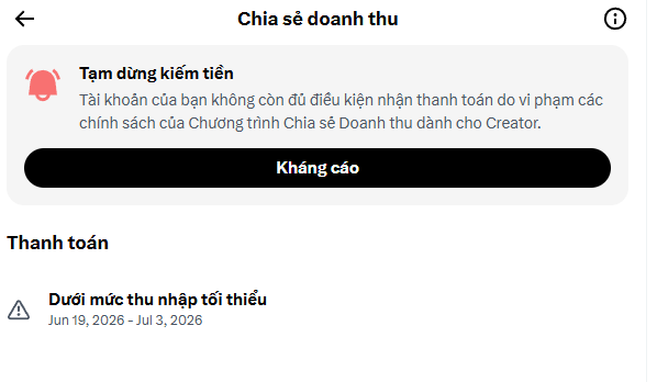 A Vietnamese-language mobile screen titled 'Chia sẻ doanh thu' (Revenue Sharing) showing an account suspension notice 'Tạm dừng kiếm tiền' with an 'Khiếu cáo' (Appeal) button.
