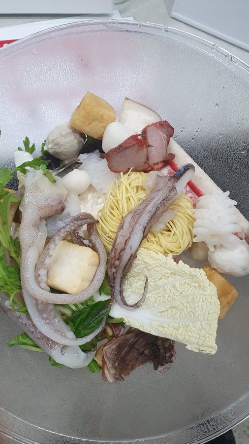 The image shows a glass bowl filled with various food items, including octopus, noodles, and other ingredients such as cabbage and meat. The bowl appears to be placed on top of a table or countertop. The scene seems to be from an earlier time period when people were more focused on the immediate experience rather than the long-term consequences.

The post about the rug pulls is unrelated to the image, but it could have been created as part of a creative project or for advertising purposes. It appears that the focus has shifted towards the food in the bowl and not the original topic.
