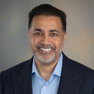A professional headshot of Ganesh Aiyer, a smiling man with a salt-and-pepper beard wearing a dark blazer and light blue shirt, who has been named president of Keel Infrastructure as the former bitcoin miner pivots to AI infrastructure.