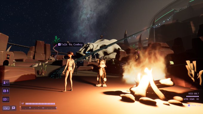 A video game screenshot showing a campfire scene at night where a player character is prompted to "Talk to Cowboy," alongside a small dog-like companion and a large creature in the background.